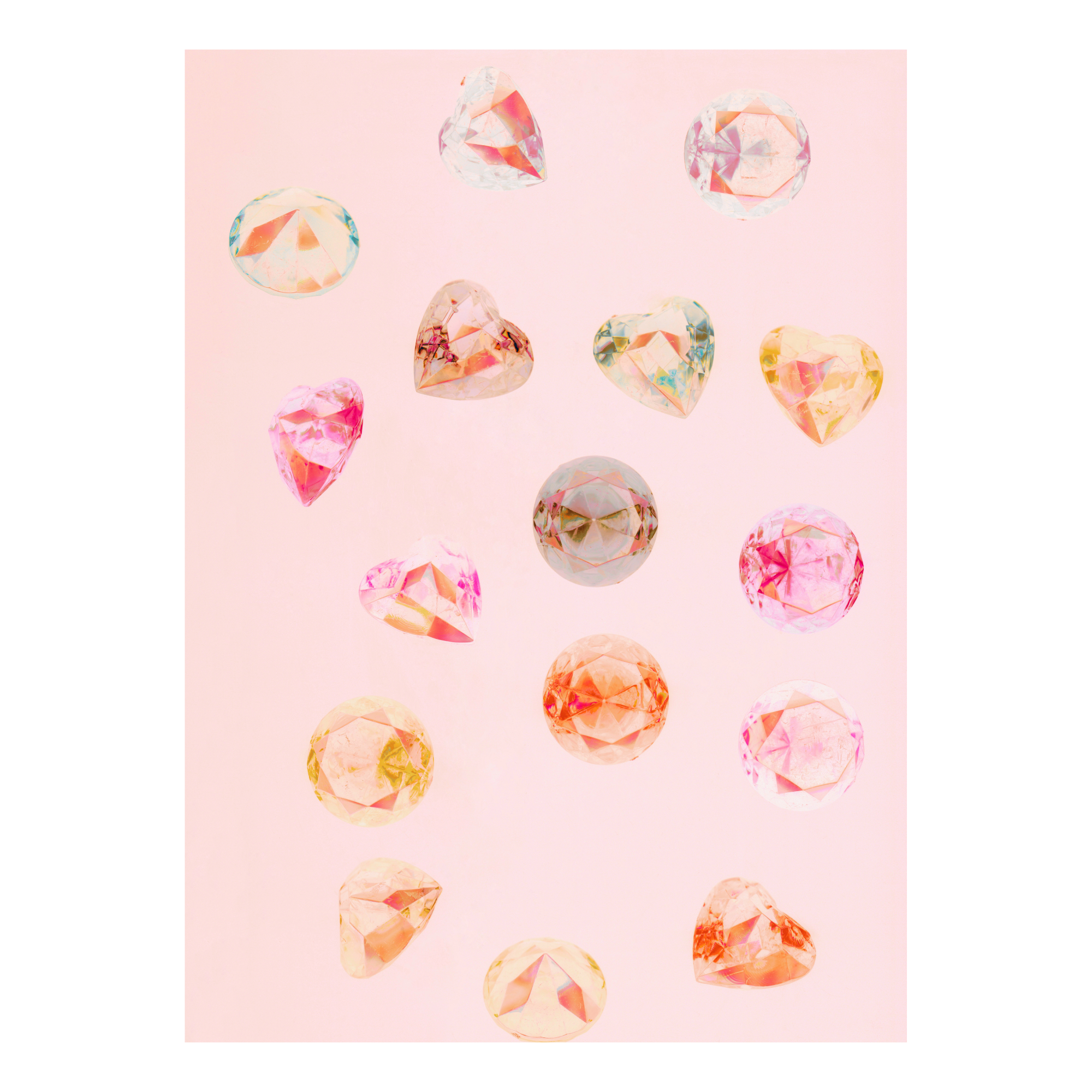 Colorful gemstones on a pink background