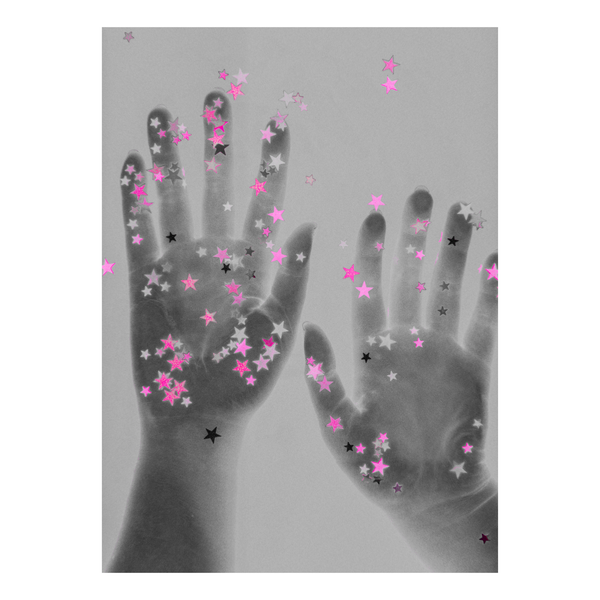 Handprints with decorative star confetti on a gray and pink background