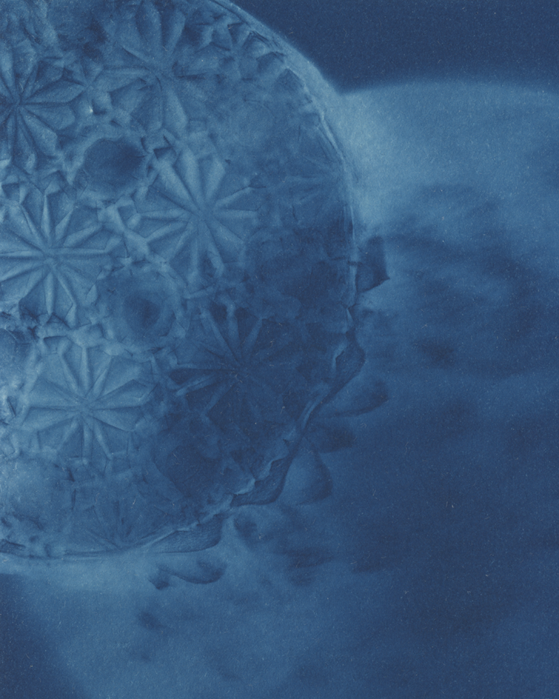 Cyanotype of glass reflected in light