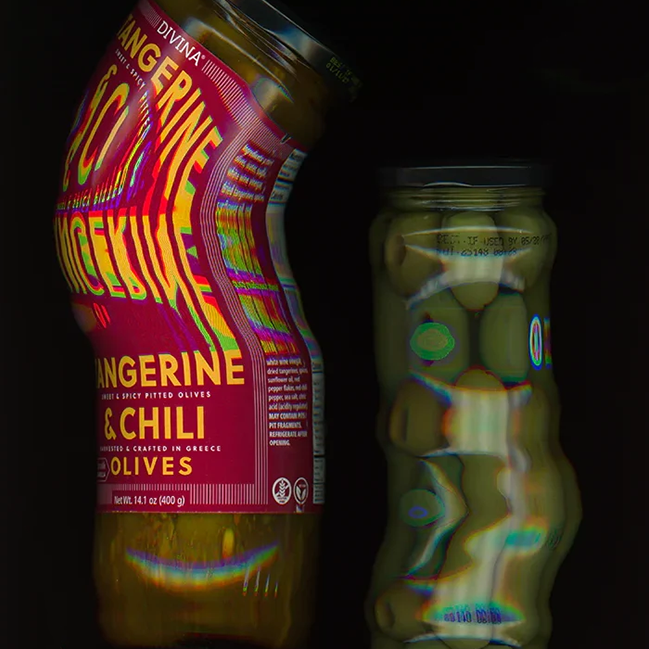 Two glass jars of Divina Market brand pickled olives on a black background scanned and abstracted by Amber Lauder. One jar is labeled 'Tangerine & Chili Olives' with a bright pink label and rainbow reflective highlights, and the other jar contains green olives with similar rainbow reflections.