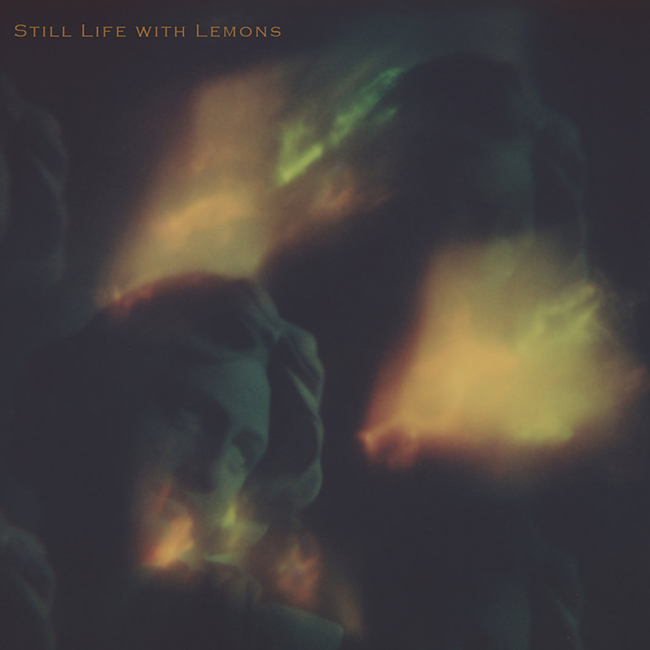 Album cover art for 'Still Life with Lemons' featuring a dark, moody composition by Amber Lauder with a Grecian bust in shadow and glowing yellow-green light effects, with the title text in the top left corner.