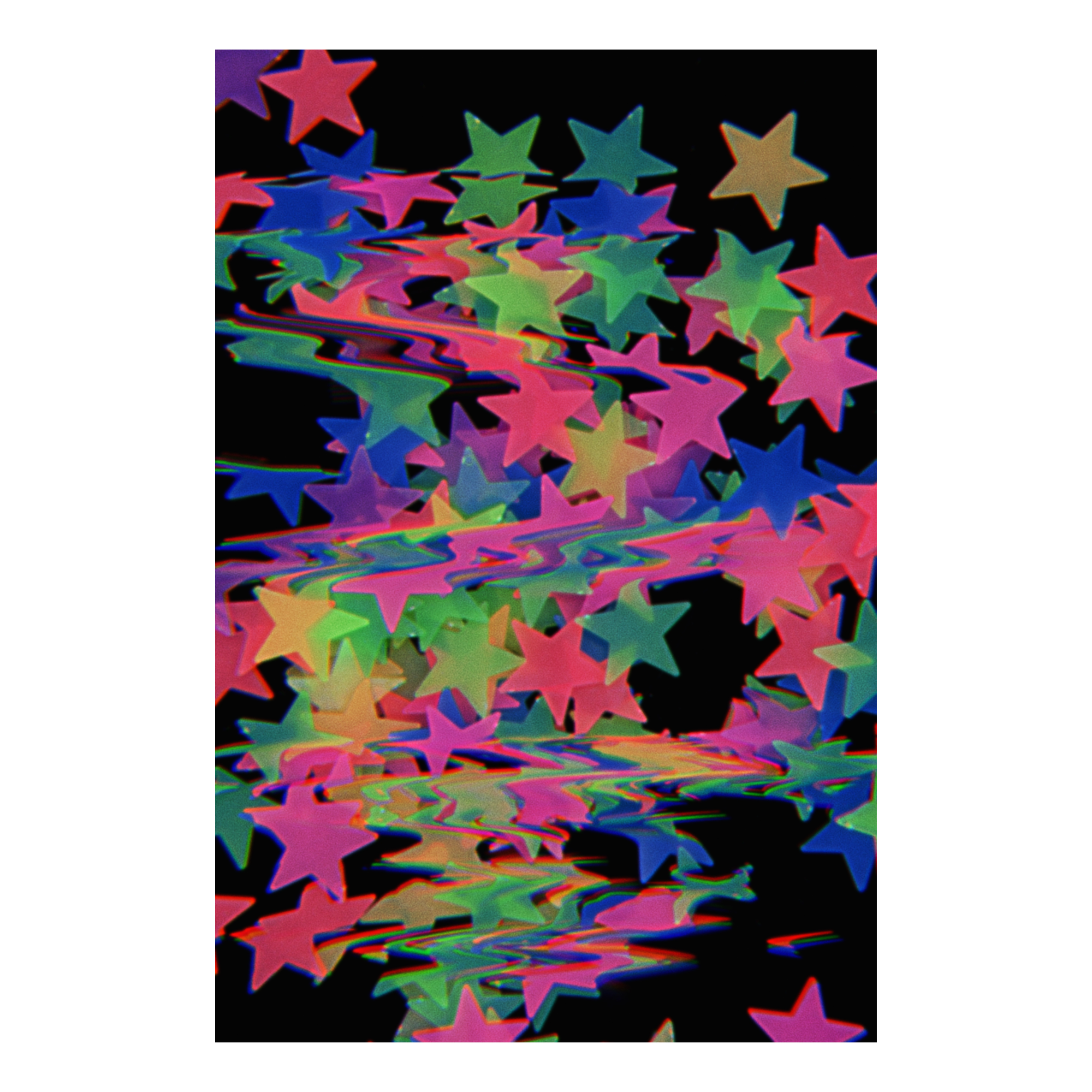 Colorful glow in the dark stars on a black background