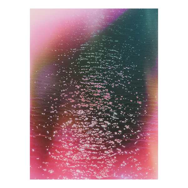 Glimmering waters with a pink and teal haze