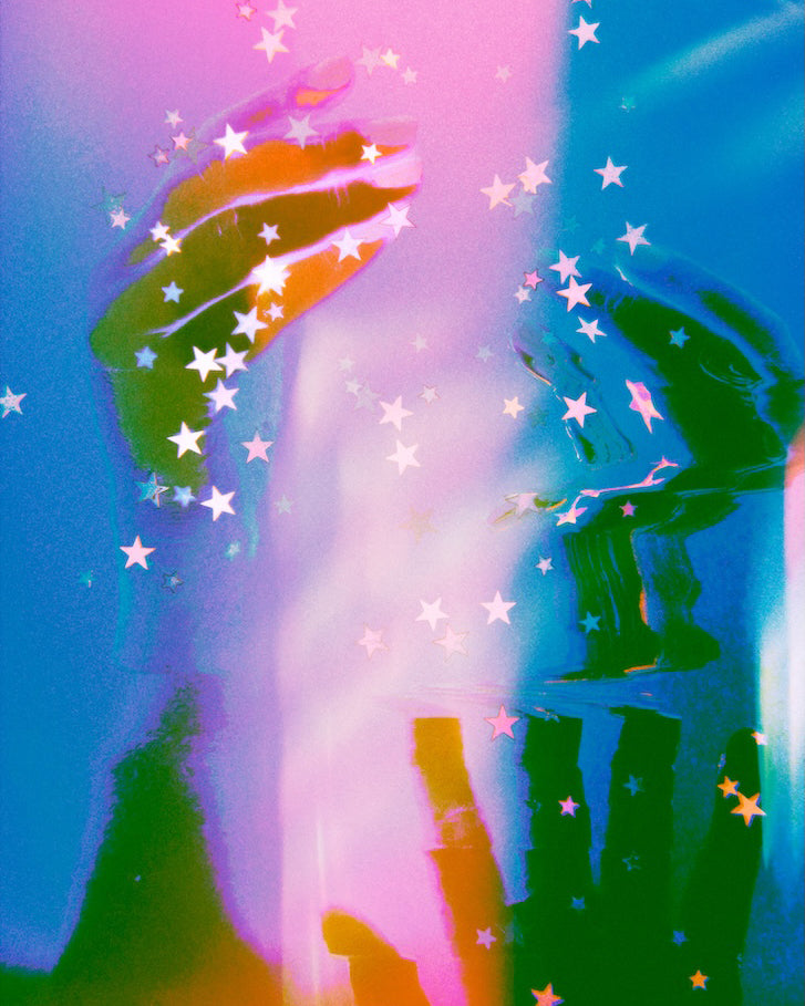 Colorful hands surrounded by and intertwined with stars on a gradient background